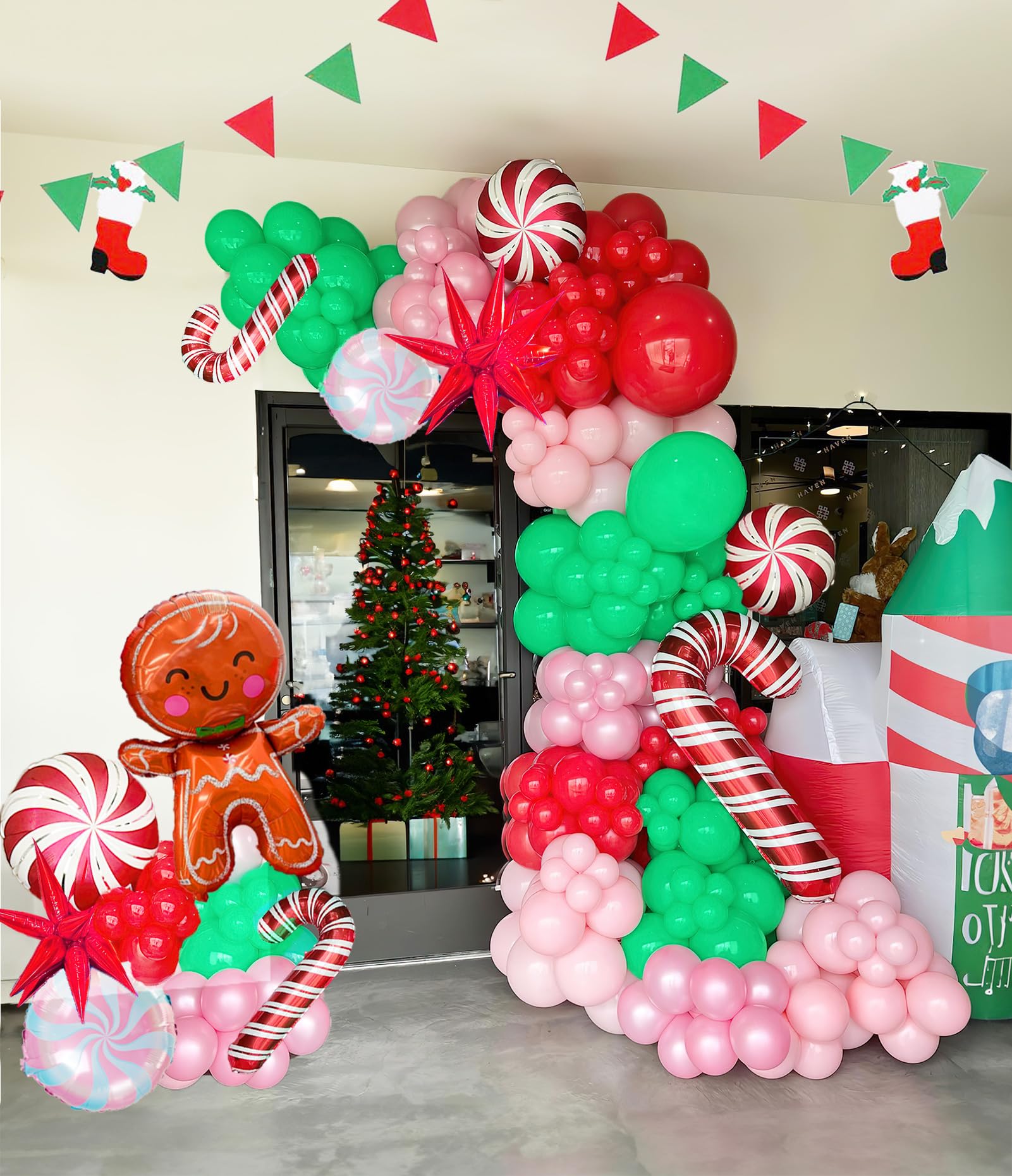 Pink red white silver Christmas balloon arch kit with candy cane foil balloons